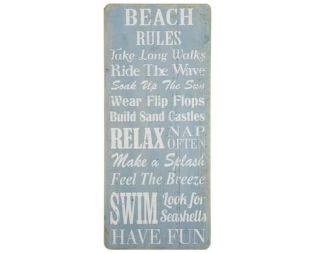 Et foto af et træskilt beach rules fra ib laursen