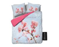 Et foto af lyseblåt sengetøj til dobbeltdyne.