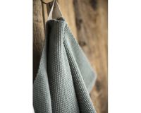 Trend foto af et strikket gæstehåndklæde i mos grøn fra ib laursen