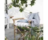 Trend foto af en lyseblå plaid med frynser i bomuld.