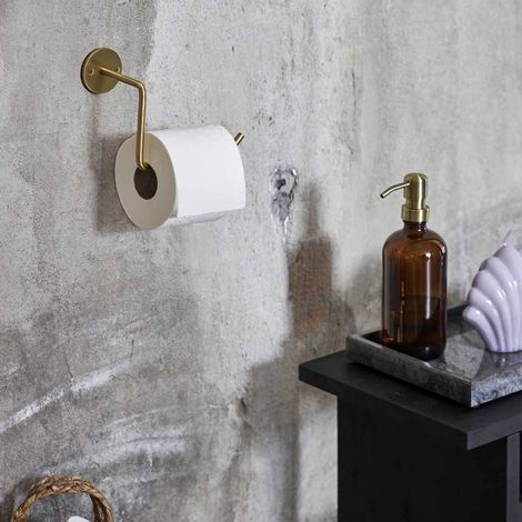 Messing toiletrulleholder på væg med toiletpapir