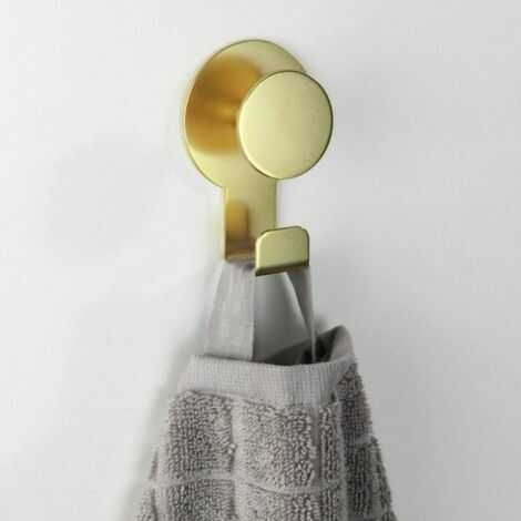 Guld knage ophængt på væg med selvklæbende lim bagpå