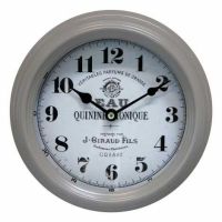 Vægur med tal latte farvet ramme i metal selve uret er hvidt med sorte tal Ø 22 cm